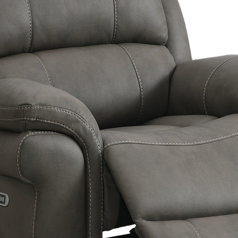 Close-up of Flynn Grey Leather Look Electric Recliner Chair with USB ports showing the padded backrest, armrest, and extended footrest with contrast stitching.
