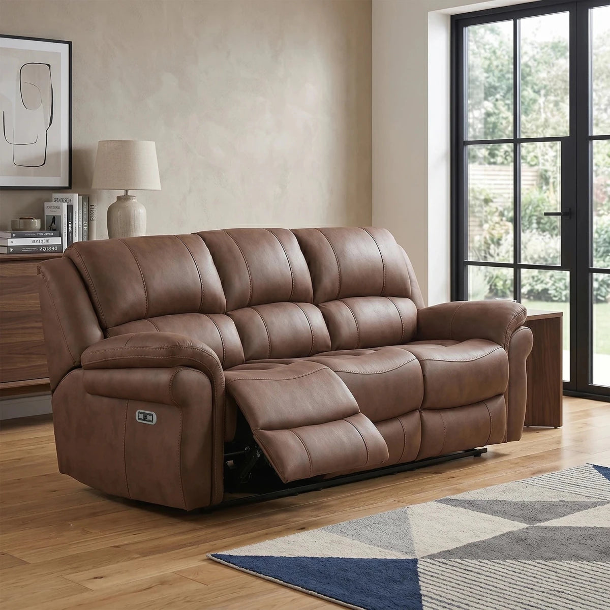 A brown leather look Fabric reclining 3 Seater sofa shown in a modern living room 