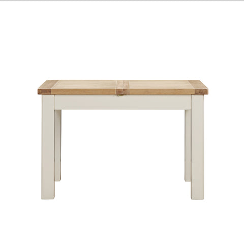 A Foxington Dining Table with a light natural wood top and off- white painted frame and legs, shown against a plain white background.