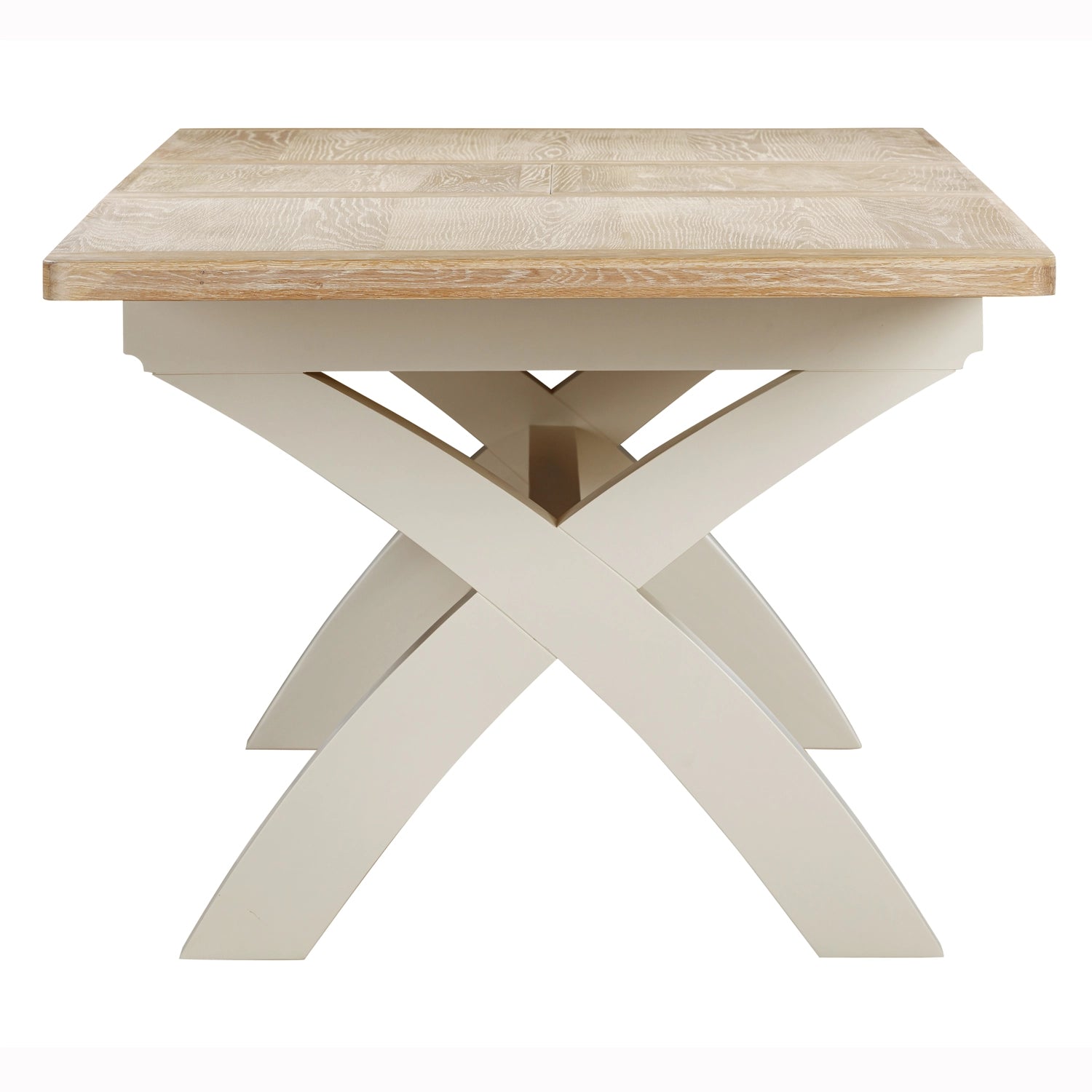 A close up of the Foxington dining table uwood top and a cream-colored X-shaped pedestal base, shown against a plain white background. 