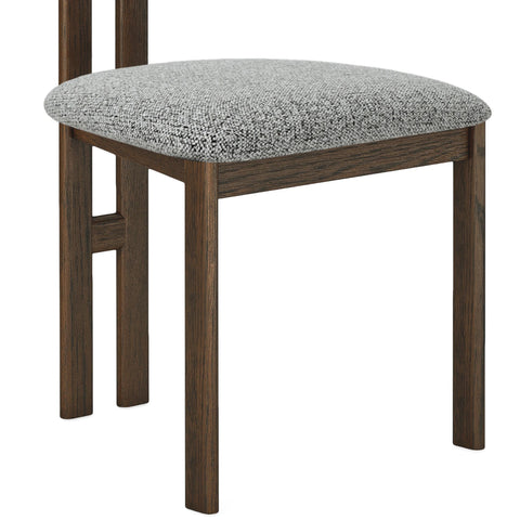 Close-up of textured grey seat and legs upholstery on dining chair