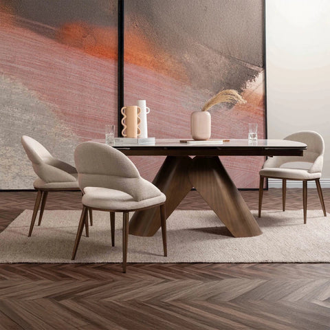 Glass House  Varenna White Ceramic Extending Dining Table, 180-240cm. Featuring a marble-effect ceramic top, sculptural bronze base and seating for up to 10.
