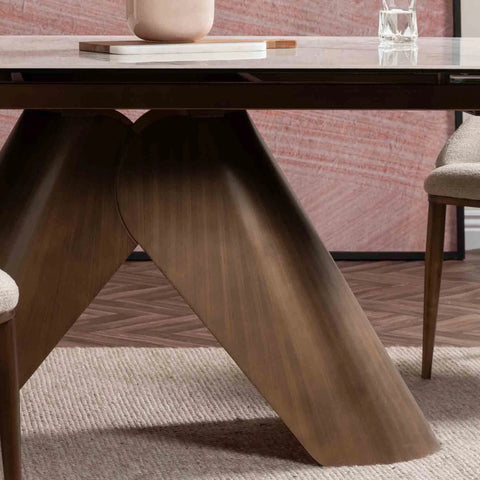 Base Close up of  Varenna White Ceramic Extending Dining Table, 180-240cm. Featuring a marble-effect ceramic top, sculptural bronze base 
