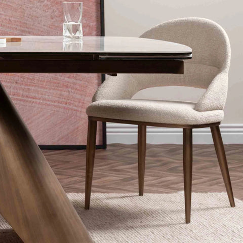 Top close up of Varenna White Ceramic Extending Dining Table, 180-240cm. Featuring a marble-effect ceramic top, sculptural bronze base 