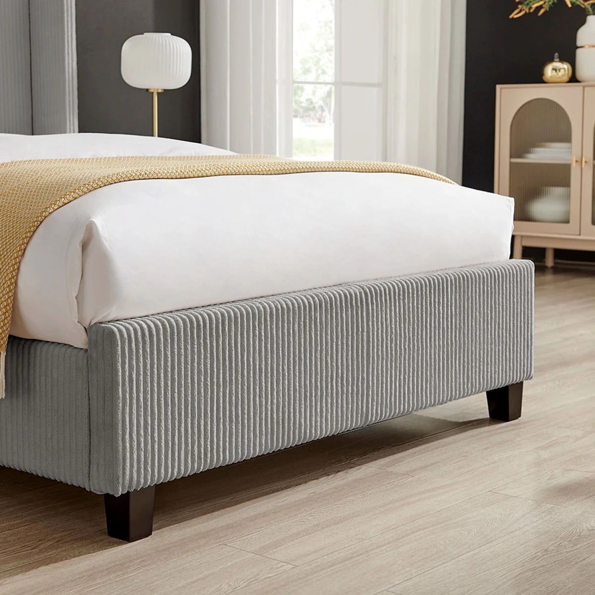 Close up of the Footend on the Gemora Luxury Bed available in Double or King Size. Shown is the plush corded fabric, also available in Natural.