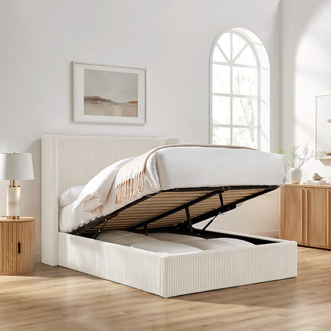 Gemora Luxury Storage Bed shown in Natural fabric with mattress lifted to show the storage under the bed.