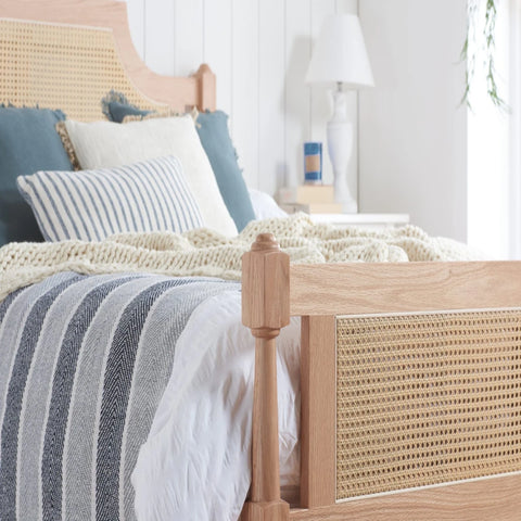 Natural oak bed frame combining strength durability.