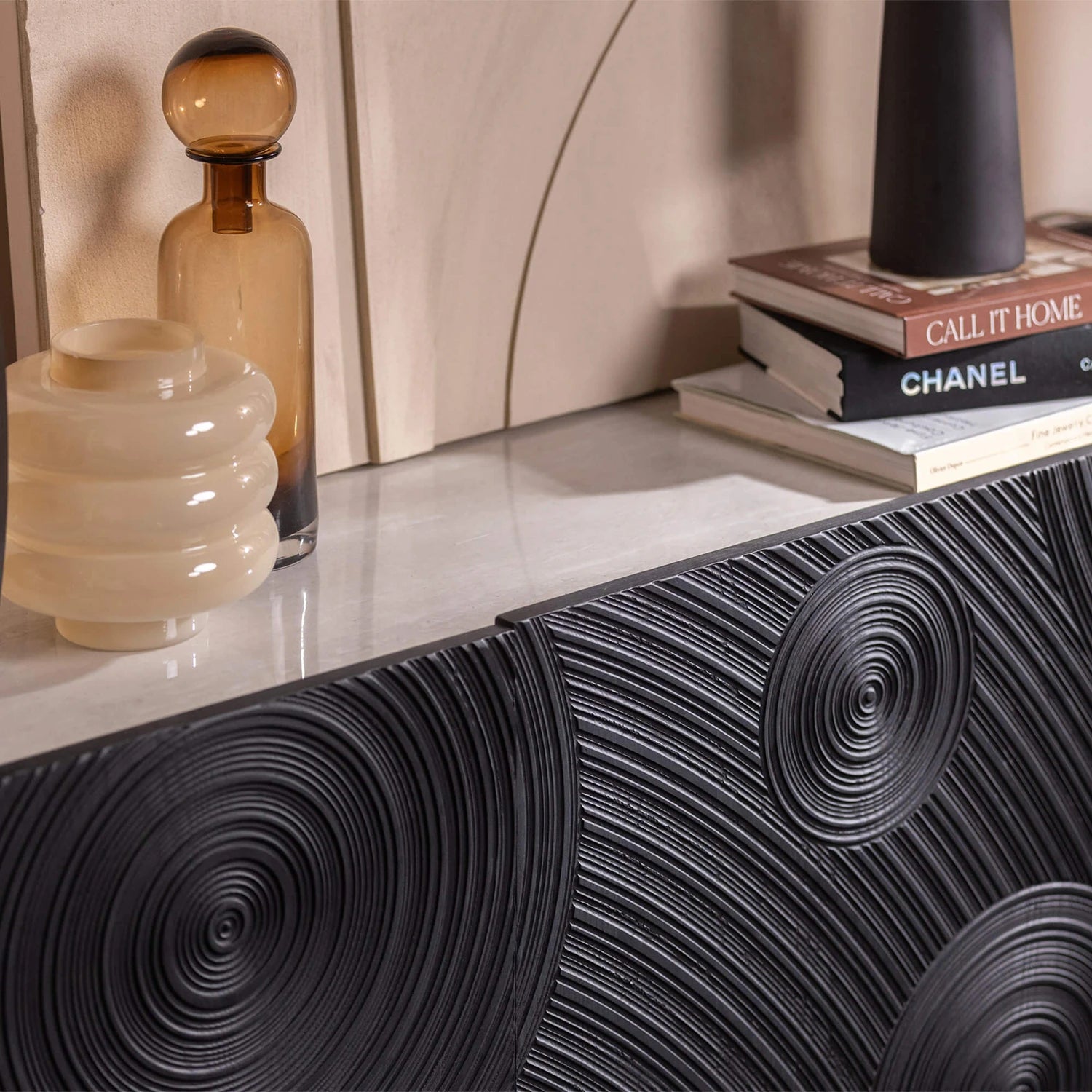 Modern black sideboard with light grey ceramic top and bronze legs