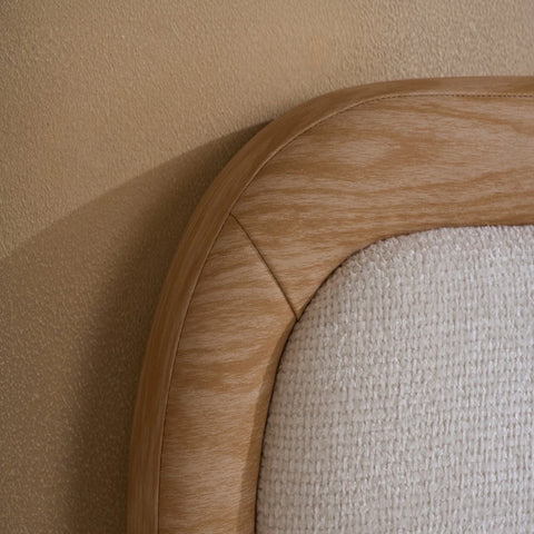Softly curved padded headboard with upholstered fabric finish.