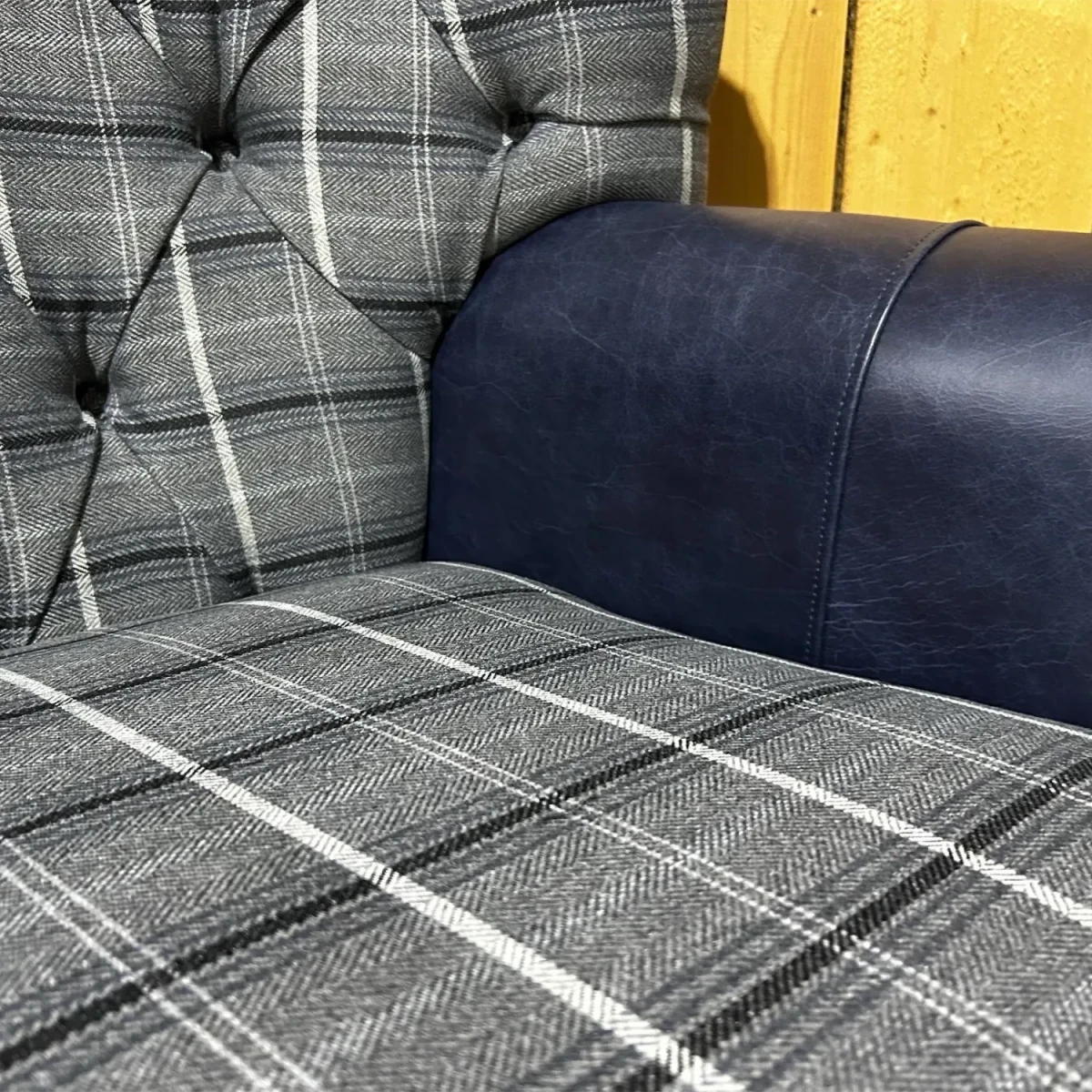 Close up of Oswald and Pablo Grey Herringbone Tweed with Night Blue Leather High Round Back Wing Chair