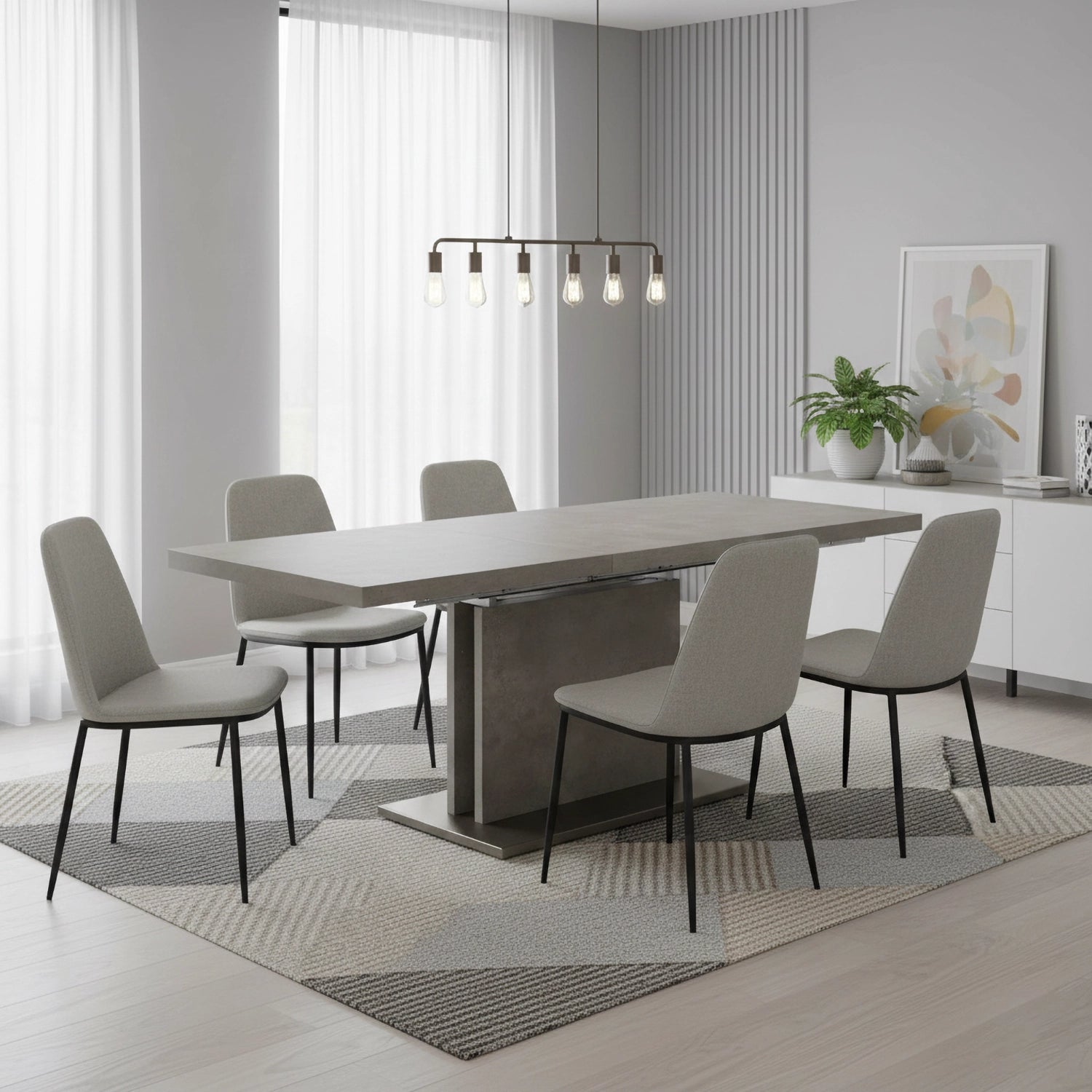 Modern dining room with a gray dining table and chairs in a bright, minimalistic setting.