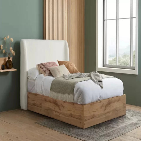 Modern bed with soft bouclé fabric adding warmth and depth.