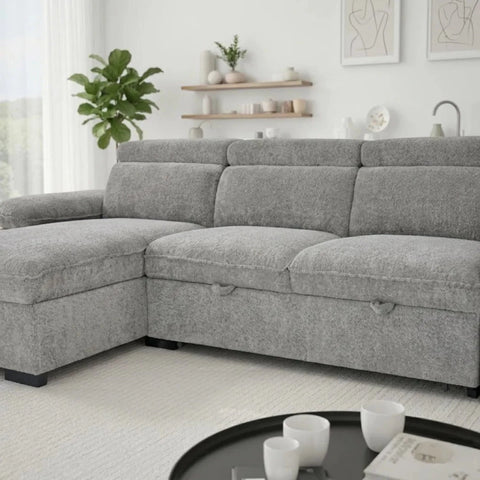 Modern L-shaped grey sofabed with textured upholstery.