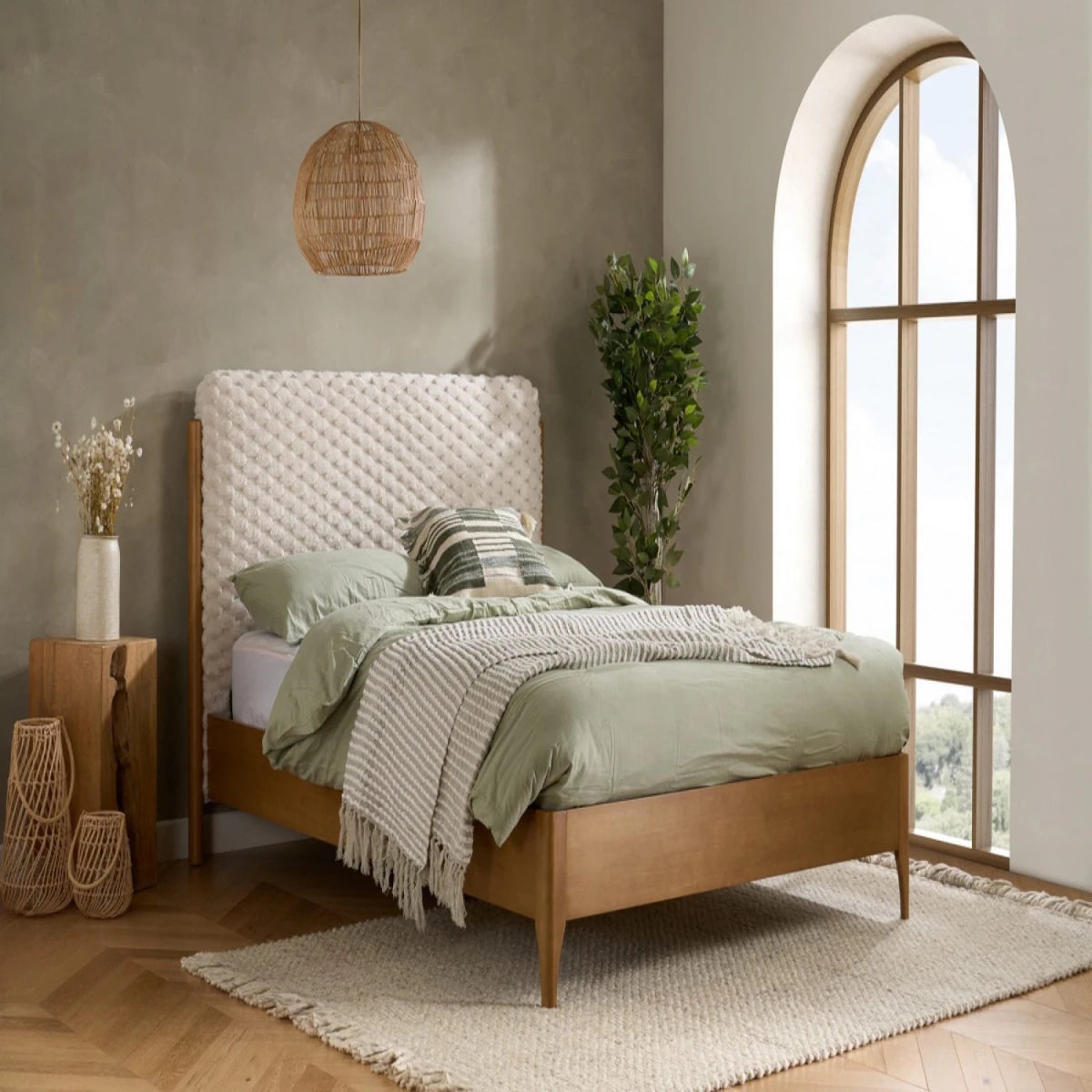 Contemporary bed with plush faux fur texture and natural wood base.