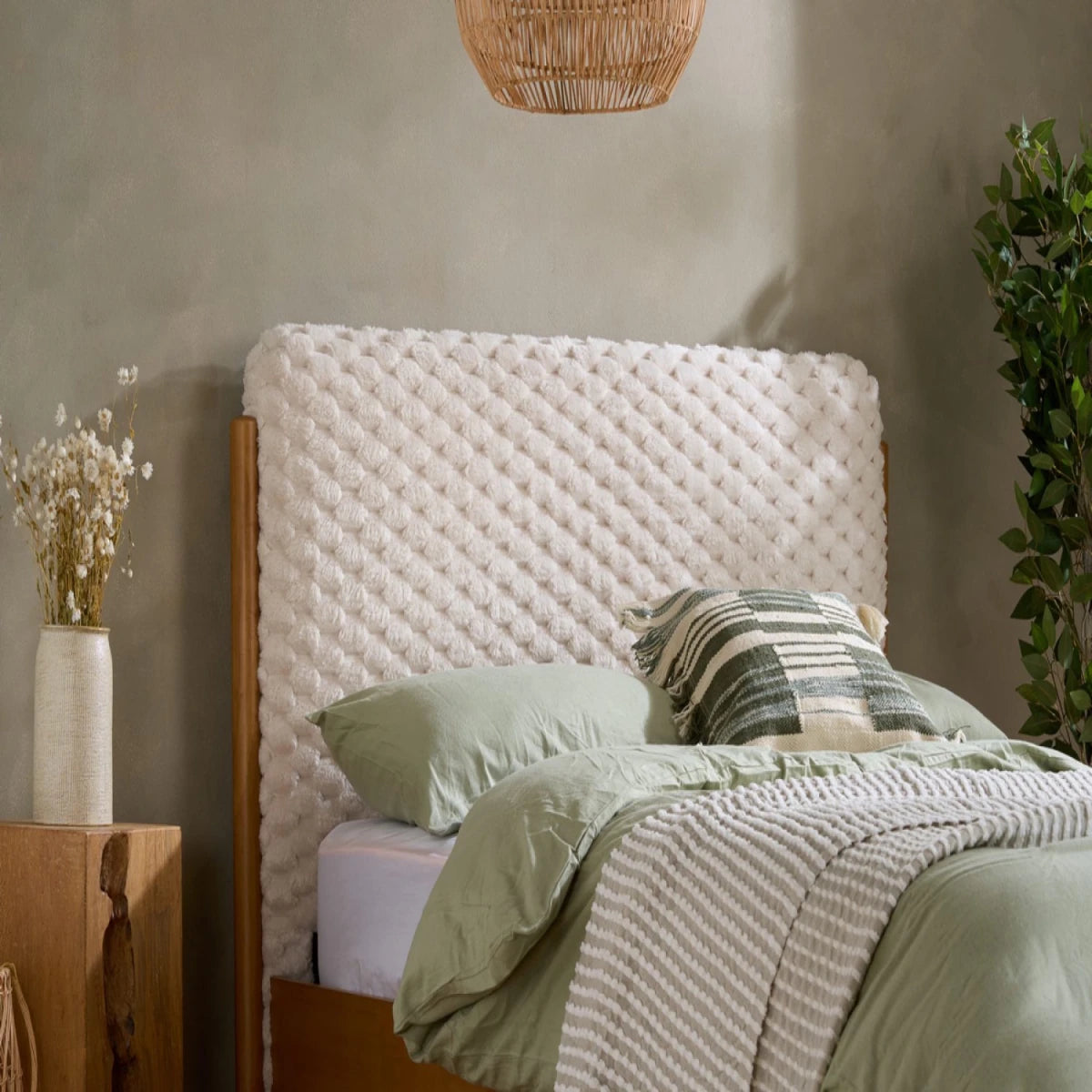 Plush faux fur headboard with soft textured finish and cosy feel.
