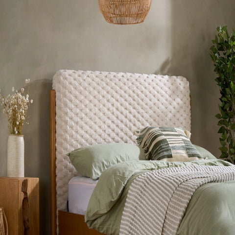 Plush faux fur headboard with soft textured finish and cosy feel.