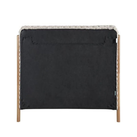 Modern headboard with fluffy faux fur upholstery.