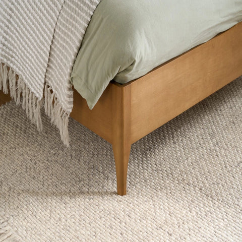 Natural wood legs ensuring reliable base support and durability.