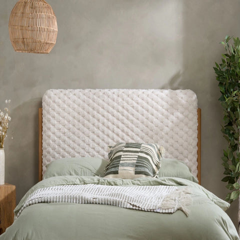 Plush faux fur headboard with soft textured finish and cosy feel.