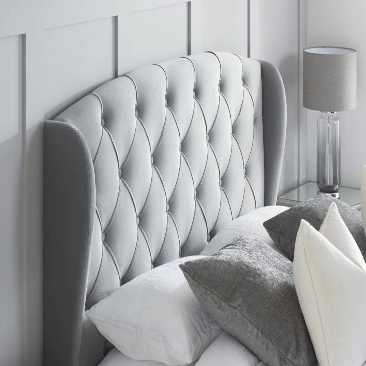 Luxurious winged headboard creating a bold statement.