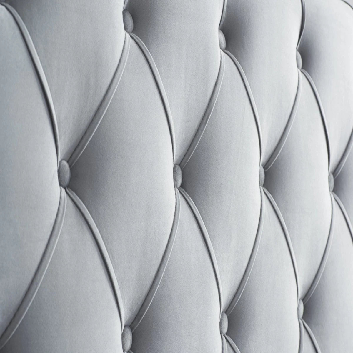 Tall wingback headboard with elegant tufted detailing.