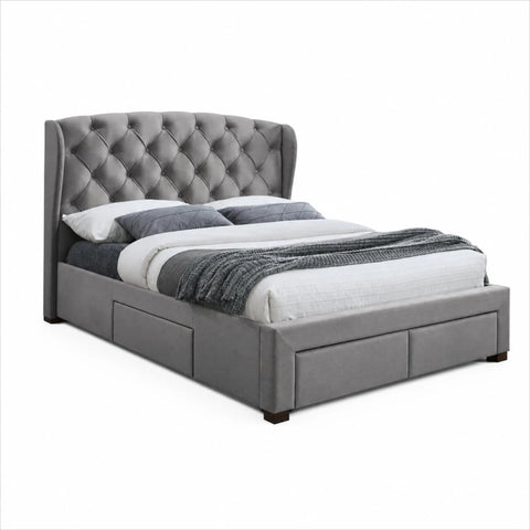 Luxury bed with wingback and tufted design.