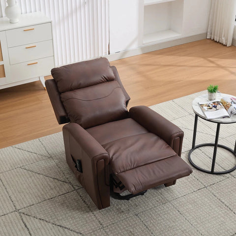 A brown leather recliner chair with the footrest extended, placed on a light gray patterned rug in a bright, modern living room with wood floors and a small round side table.