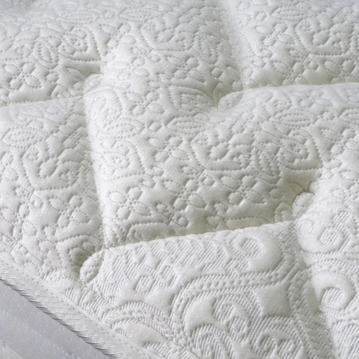 Medium support mattress with foam encapsulated springs