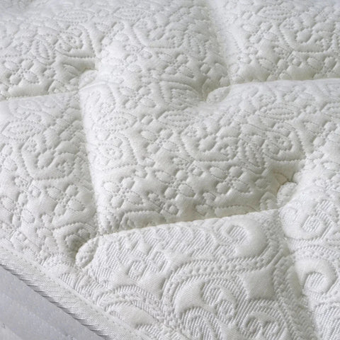 Medium support mattress with foam encapsulated springs