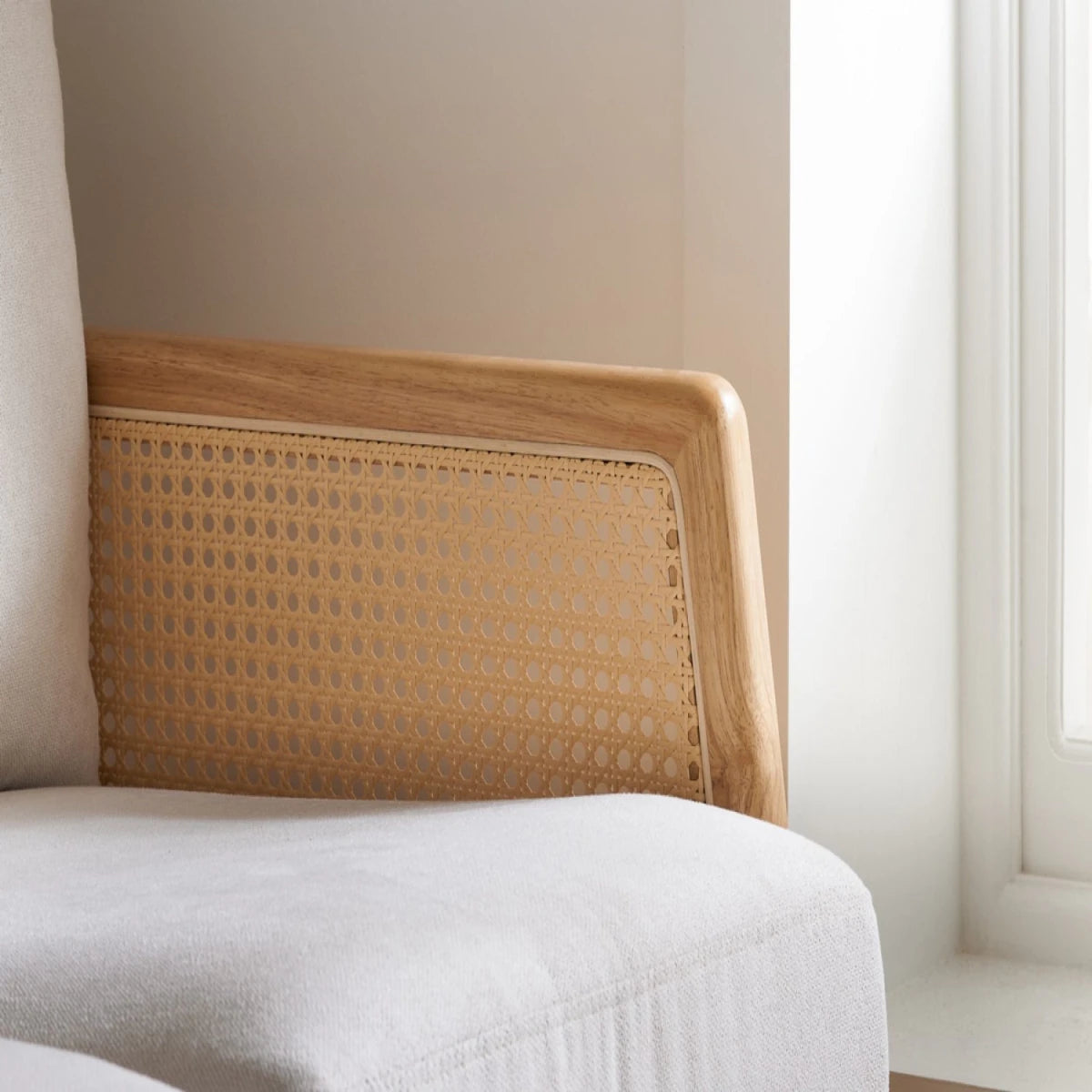Elegant seating combining rattan and fabric.