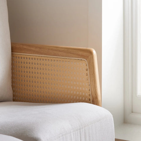 Elegant seating combining rattan and fabric.
