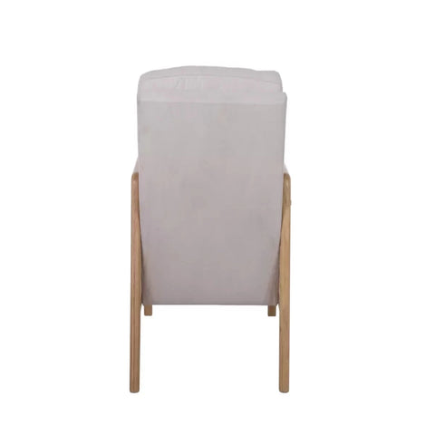 Modern armchair with rattan sides and soft cushions.