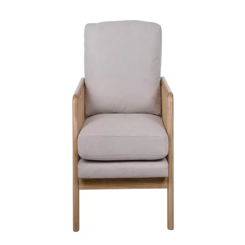 Modern armchair with rattan sides and soft cushions.