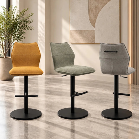 Shop Iris Fabric Adjustable Bar Stools, Set of 2. Available in Grey, Green or Mustard with padded seats, swivel function and black metal pedestal bases.