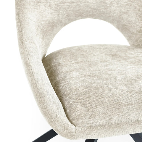 Close-up of a beige upholstered chair with a white background