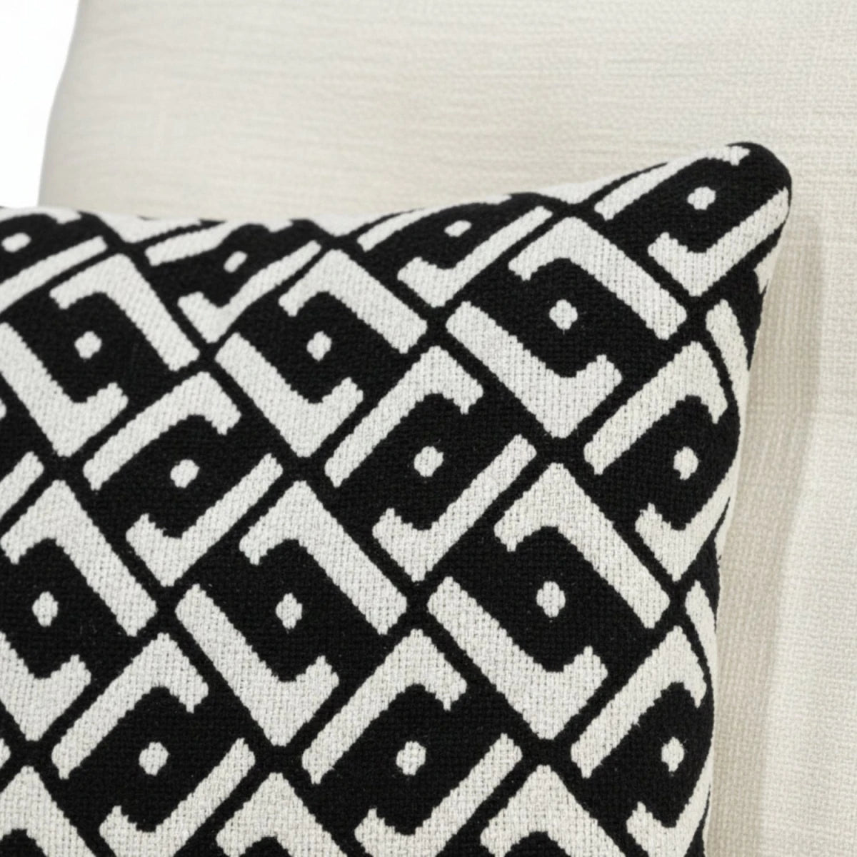 Soft decorative cushions adding depth and contrast.