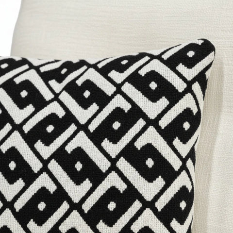 Soft decorative cushions adding depth and contrast.