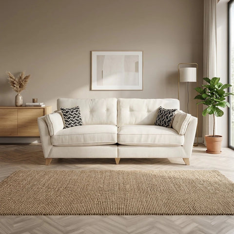 Spacious 4 seater sofa with soft fabric upholstery and accent cushions.