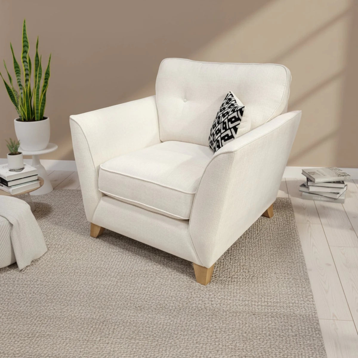 Modern accent chair with soft upholstery and mid-century style.