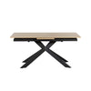 A modern rectangular dining table with a light natural wood top and a black metal X-shaped base, shown on a plain white background.