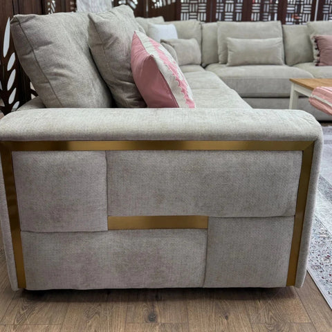 Soft high-quality beige fabric corner sofa with smooth finish.
