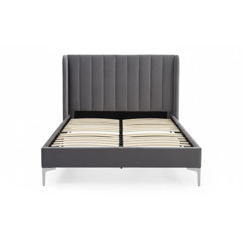 Athena Grey Velvet Bed with stitched headboard and brass silver legs. 