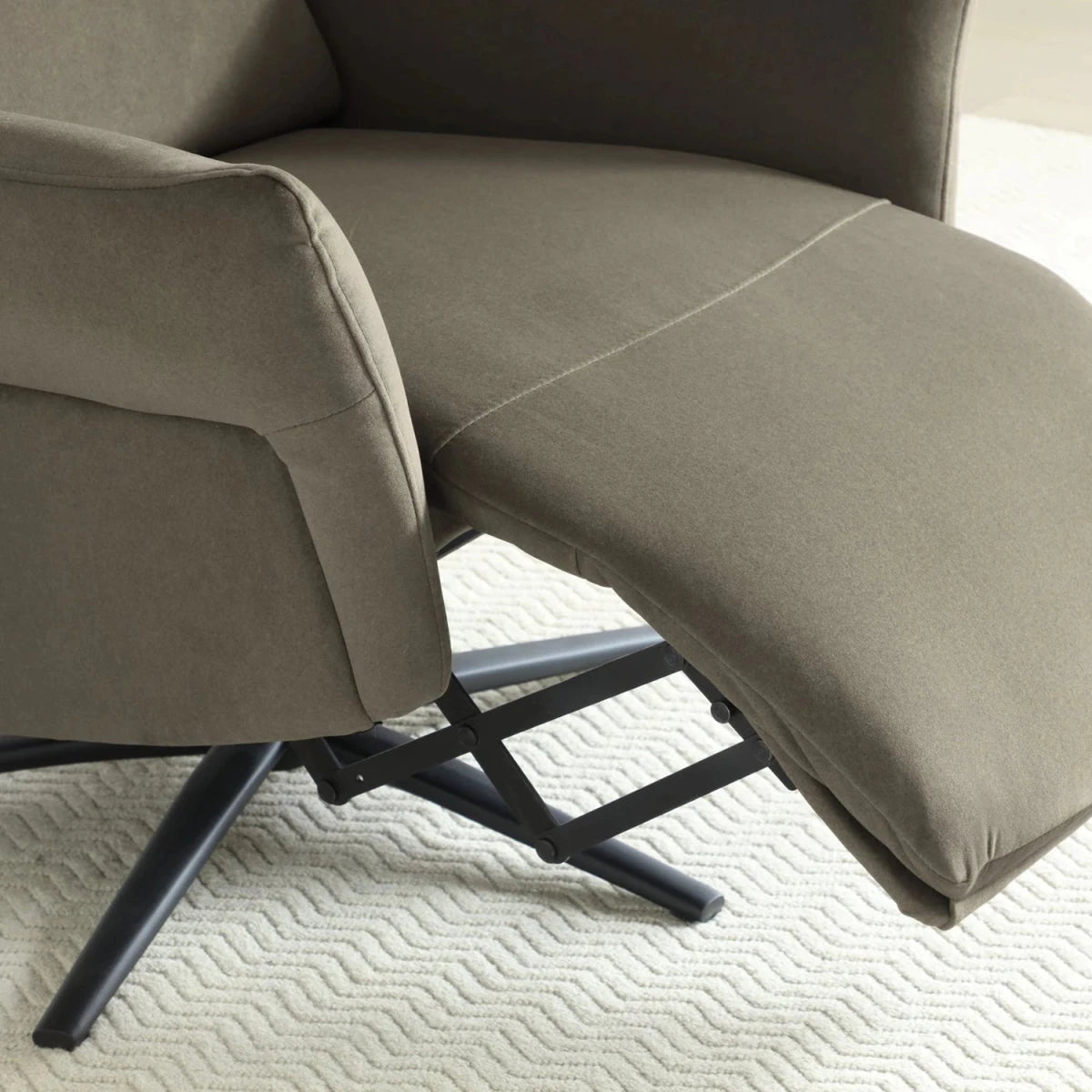 Close up Electric recliner chair in washed olive upholstery
