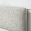 Close up of Headboard of Natural Upholstered Bed with End Opening Ottoman Storage