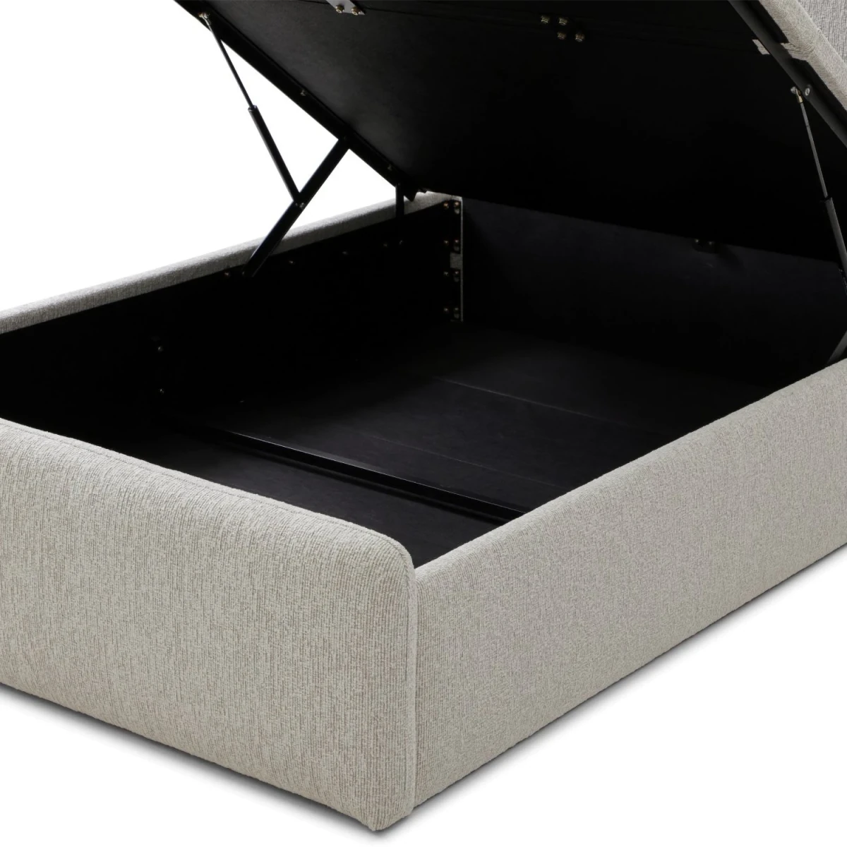 A light beige upholstered storage bed with the top cushion lifted open to show the black-lined storage compartment, photographed on a white background.