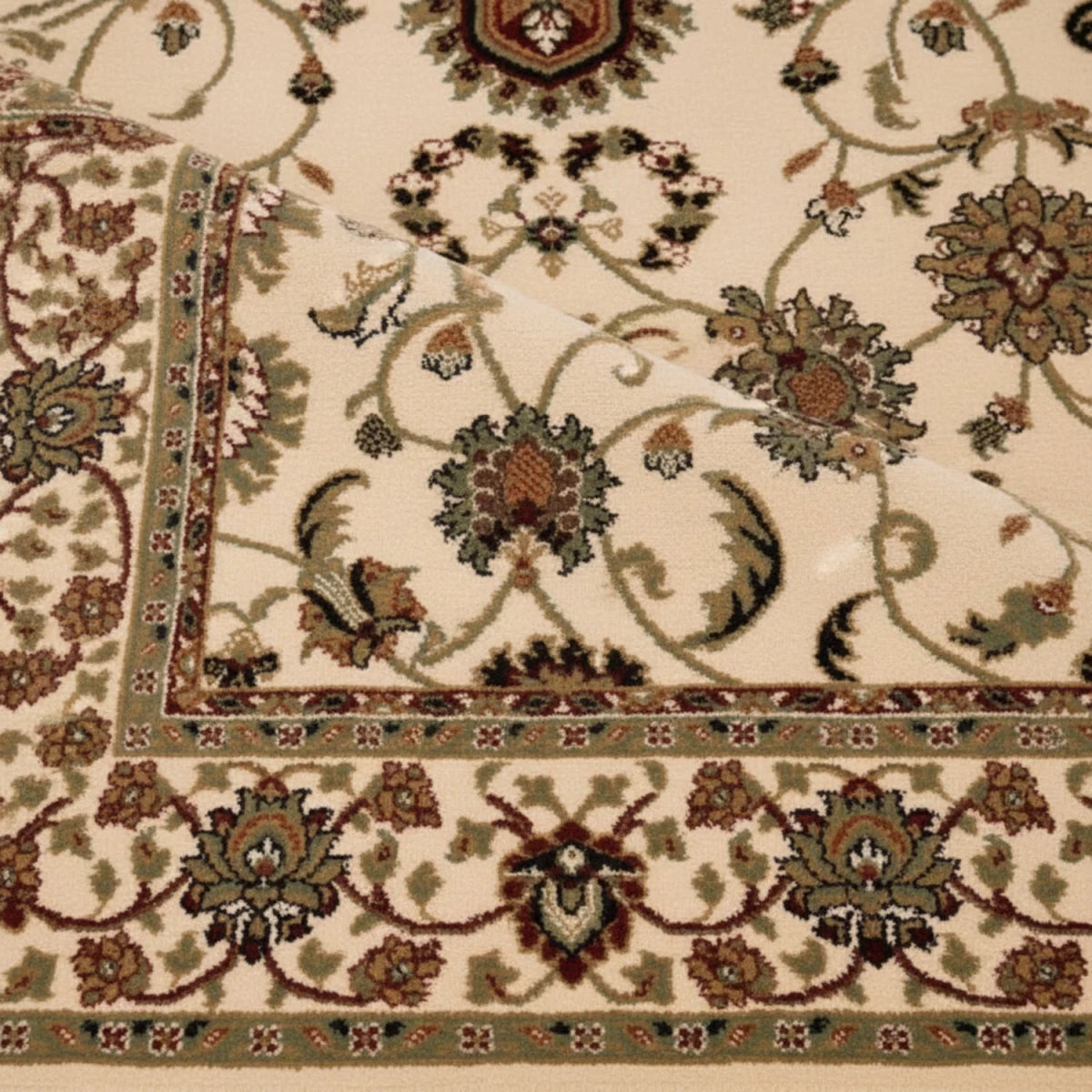 Neutral round rug with delicate floral pattern and soft pile.