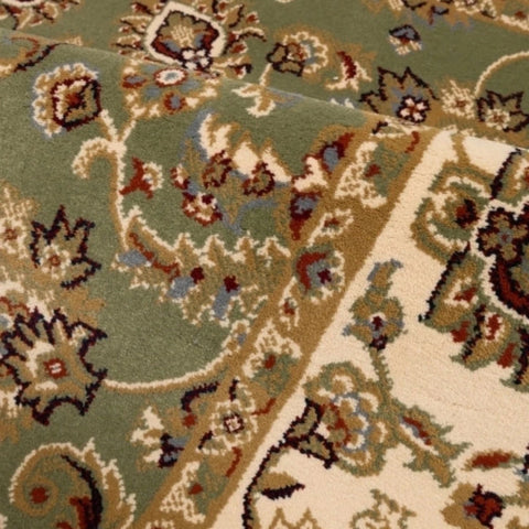 Timeless rug design with rich green tones.