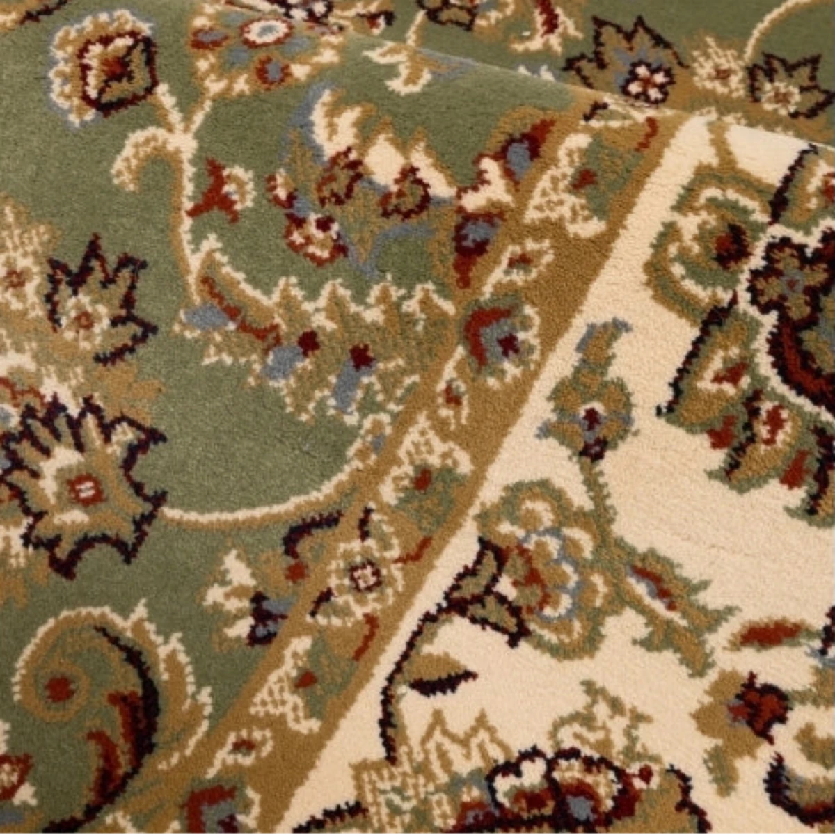 Decorative green rug with intricate woven motifs.