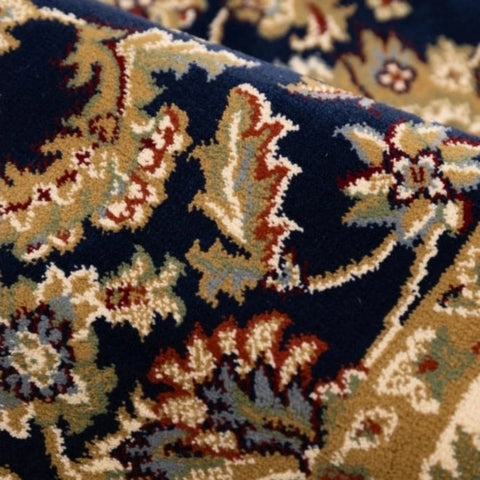 Decorative navy rug with intricate woven motifs.