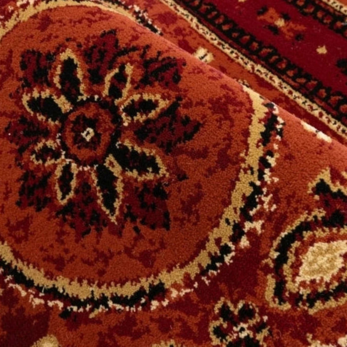 Warm terracotta rug with eye-catching tribal style.